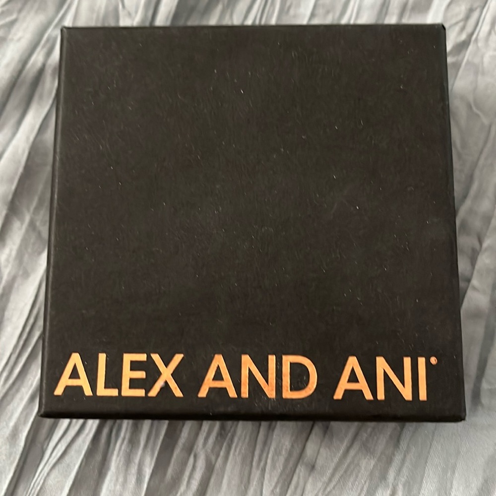 Twelve Alex and Ani bracelets